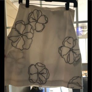 Casual Corner A lined white skirt with black knitting.  Worn once.